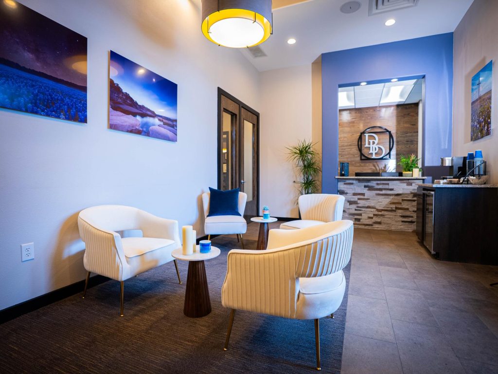 Interior of Dentistry By Design dental office with modern waiting area.